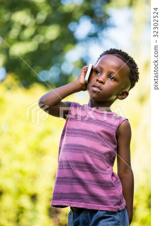 A child is having phone call 32302524