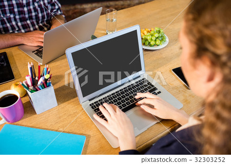 business woman working at computer desk business woman working at computer desk 32303252