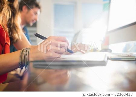 Colleagues using a graphic pad Colleagues using a graphic pad 32303433