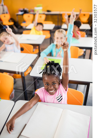 Pupils raising their hands Pupils raising their hands 32303577
