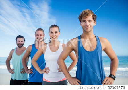 Friends standing in a row Friends standing in a row 32304276