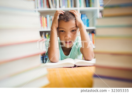 Boy sitting at a desk Boy sitting at a desk 32305335