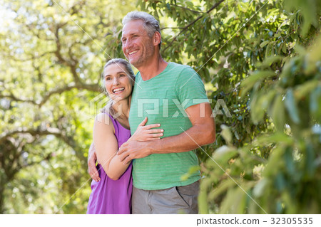 Couple smiling and holding each other Couple smiling and holding each other 32305535