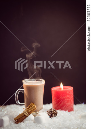 close up view of composite image of hot chocolate and candle close up view of composite image of hot chocolate and candle 32305751