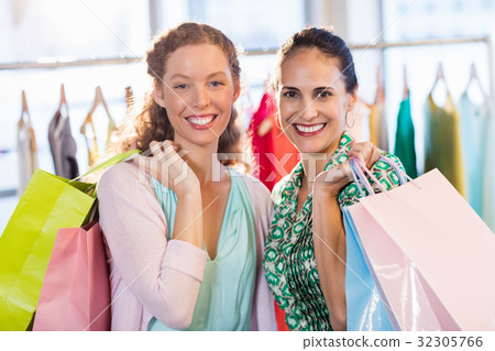 Females friends with shopping bags 32305766