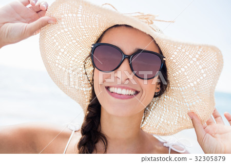 Portrait of smiling woman on the beach Portrait of smiling woman on the beach 32305879