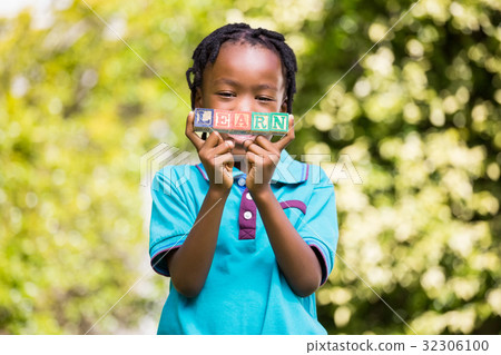 Boy holding the word learn 32306100