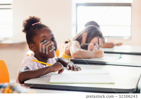 A smiling pupil posing for the camera 32306243