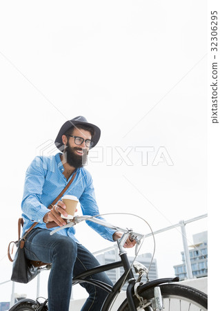 Hipster doing bicycle 32306295