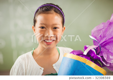 Cute girl smiling at camera 32306569