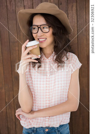 Hipster woman drinking a coffee 32306921