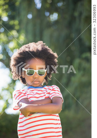 Boy is wearing sunglasses Boy is wearing sunglasses 32306993