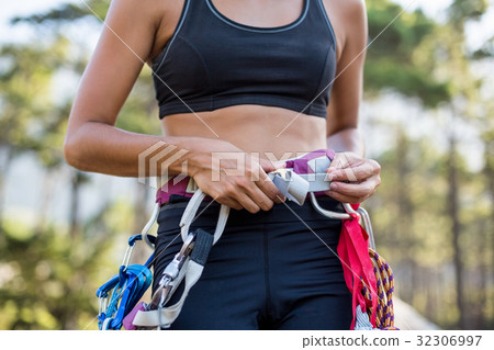Close up climbing equipment on a woman Close up climbing equipment on a woman 32306997