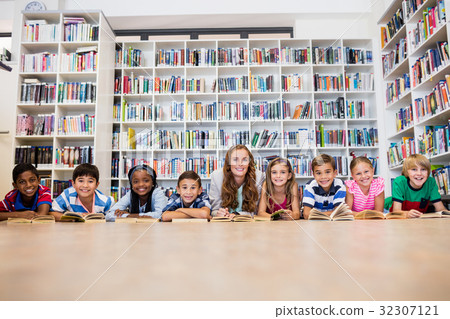 Teacher reading books to her students Teacher reading books to her students 32307121