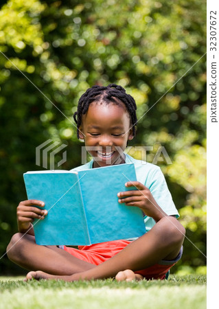 Boy is reading a book Boy is reading a book 32307672