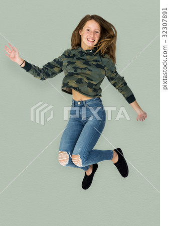 Young Adult Woman Jumping Studio Portrait 32307891
