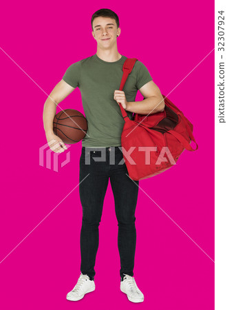 Young adult muscular man holding basketball Young adult muscular man holding basketball 32307924