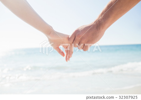 happy couple holding hands happy couple holding hands 32307925