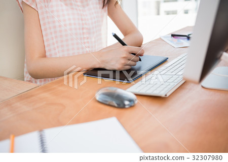 Hipster woman using a tablet Hipster woman using a tablet 32307980
