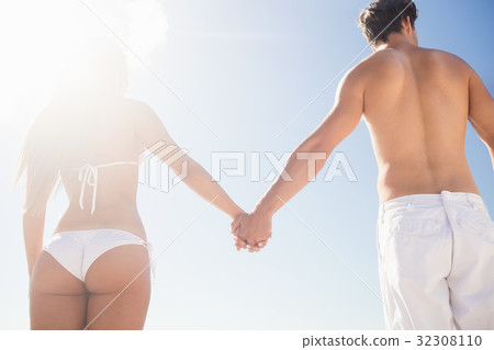 happy couple holding hands happy couple holding hands 32308110