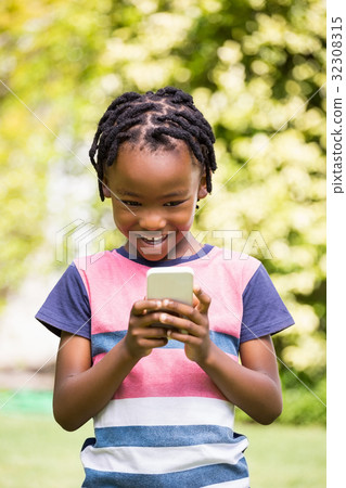 Boy using a smartphone 32308315