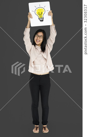 Young adult asian girl smiling and holding light bulb banner 32308317