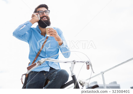 Hipster calling someone 32308401
