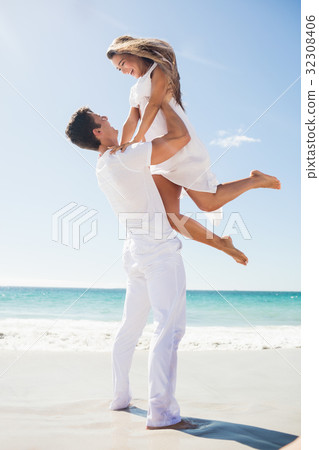 Portrait of handsome man holding his girlfriend 32308406