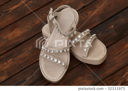 Pair of beige leather female sandals Pair of beige leather female sandals 32311973
