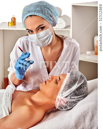 Dermal fillers of man in spa salon with beautician 32312869