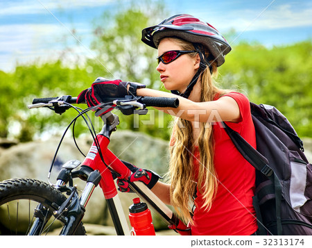 Woman traveling bicycle summer park. Early morning 32313174