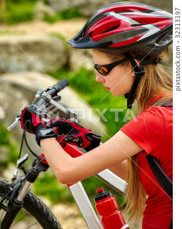Woman traveling bicycle summer park. Girl with 32313197