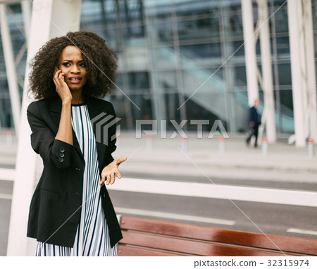 Beautiful afro-american girl is upset while 32315974