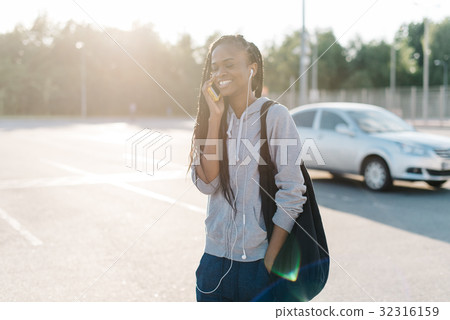 Half-length portrait of the cheerful afro-american Half-length portrait of the cheerful afro-american 32316159