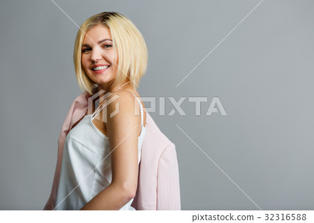 Smiling blonde on empty background Smiling blonde on empty background 32316588