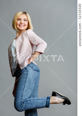 Girl raised leg in studio Girl raised leg in studio 32316589