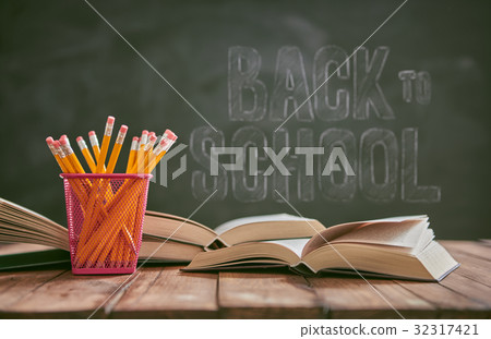 Pencils and pile of books Pencils and pile of books 32317421