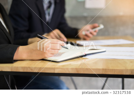 business man financial inspector and secretary making report, ca business man financial inspector and secretary making report, ca 32317538