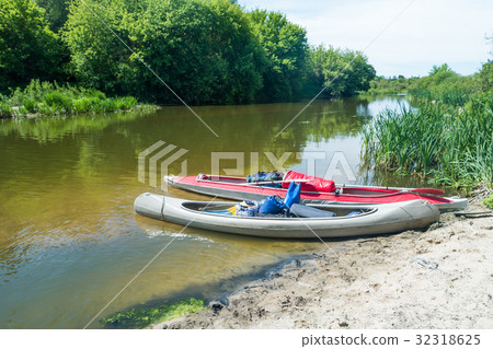 Two kayaks standing in water 32318625