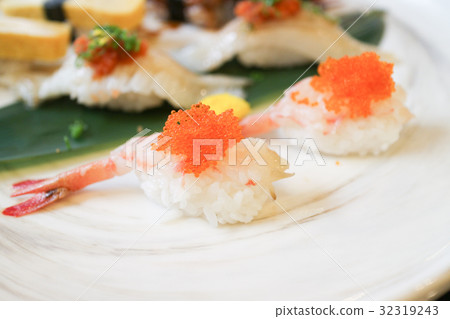 shrimp sushi with orange fly fish eggs on top shrimp sushi with orange fly fish eggs on top 32319243