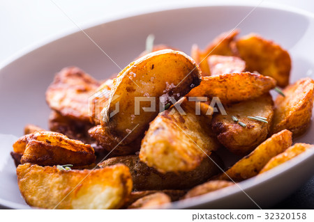 American potatoes with salt rosemary and cumin American potatoes with salt rosemary and cumin 32320158