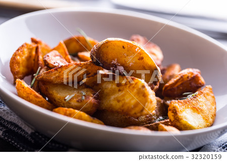 American potatoes with salt rosemary and cumin 32320159