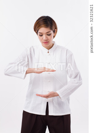 peaceful asian woman practice kungfu qigong peaceful asian woman practice kungfu qigong 32321621