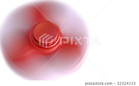 Swirling red fidget spinner on white background. Swirling red fidget spinner on white background. 32324133