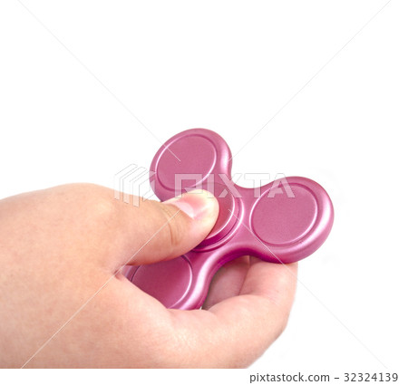 Fidget spinner in hand on white background. Fidget spinner in hand on white background. 32324139