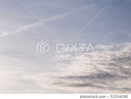 high white clouds in winter with clear blue sky. high white clouds in winter with clear blue sky. 32324290
