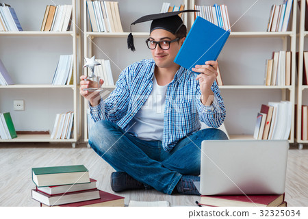 Young student studying with books Young student studying with books 32325034