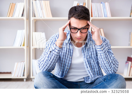 Young student studying with books Young student studying with books 32325038