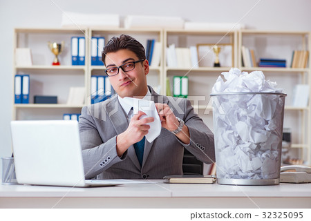 Businessman in paper recycling concept in office 32325095