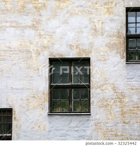 shabby facade of old house in Riga city shabby facade of old house in Riga city 32325442